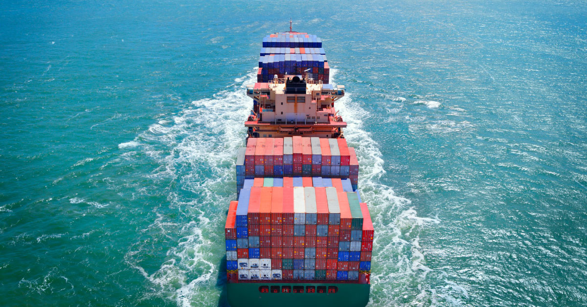 Cargo ship with colorful containers holding Chinese pea protein travels through open ocean