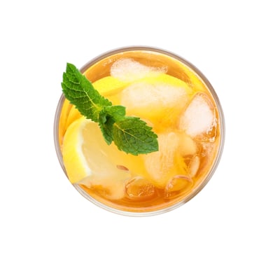 Glass of iced team with mint leaf and ice.