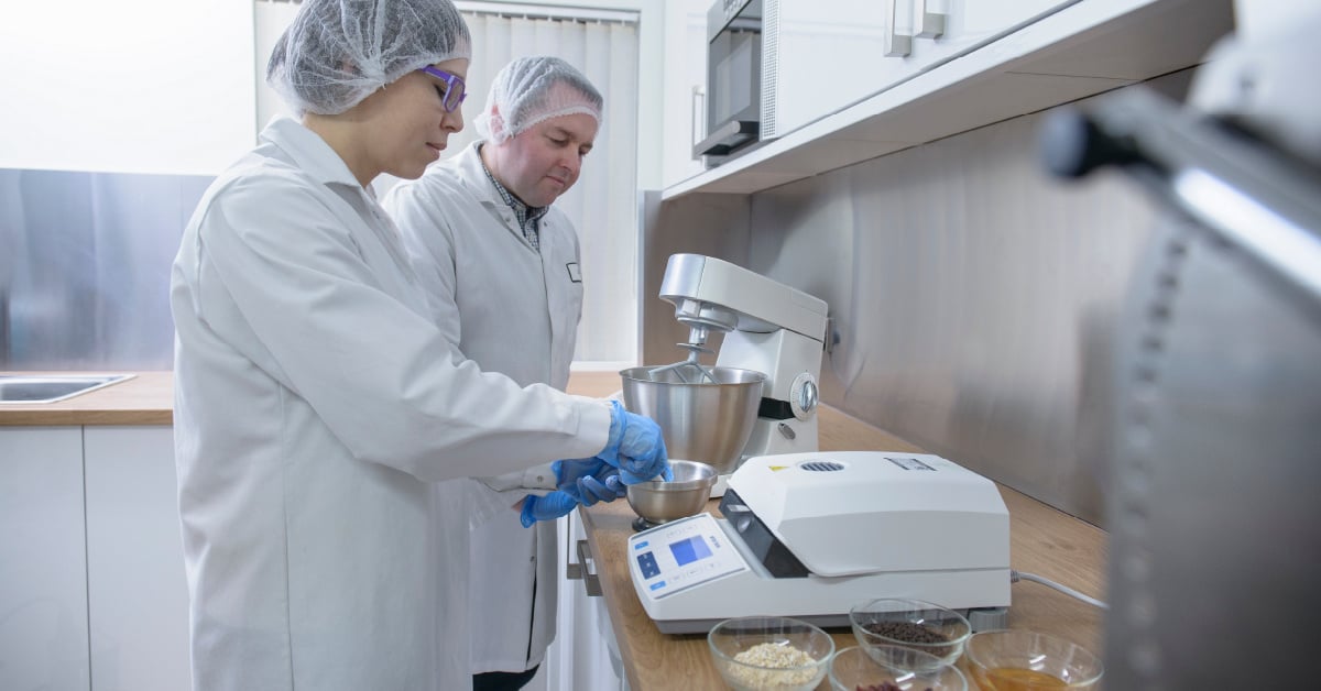 Food scientists evaluate a recipe in a test kitchen. 